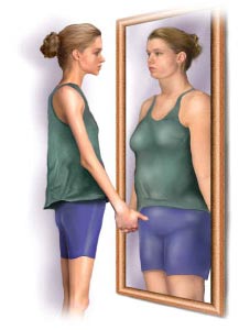 Picture of woman looking at herself in the mirror