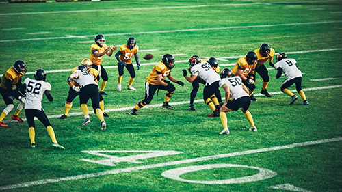 football game with teams near the 40 yard line 