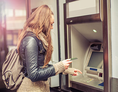 girl at an ATM