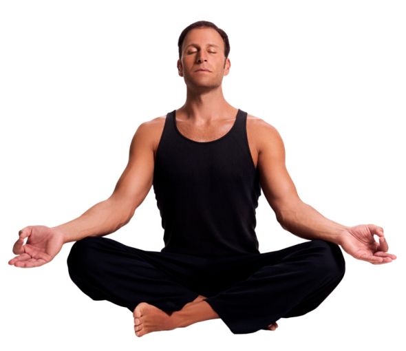 man in black yoga pants and a black tank top sitting in a yoga pose with his eyes closed, legs crossed, arms resting on his knees, palms open, and forefinger and thumb touching.