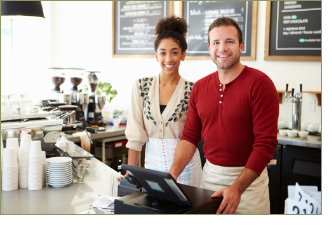 "Image depicts two individuals behind the counter at a new business"