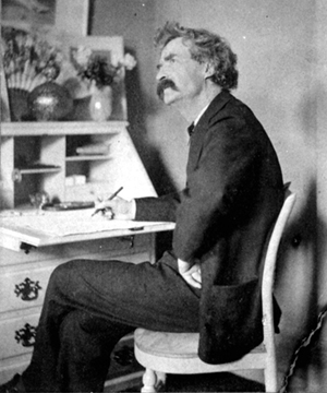 Mark Twain at a desk