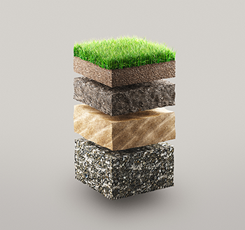 four layers of ground, including soil and grass, shown separated into different materials