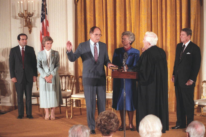 William Rehnquist takes the oath as Chief Justice from retiring Chief Justice Warren E. Burger in 1986.