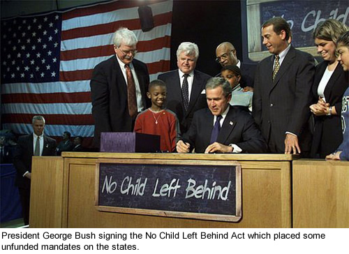 President George Bush signing the No Child Left Behind Act.