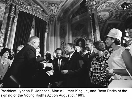 President Lyndon B. Johnson, Martin Luther King Jr., and Rosa Parks at the signing of the Voting Rights Act on August 6, 1965.