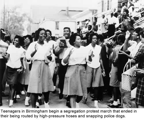 Teenagers in Birmingham begin a segregation protest march that ended in their being routed by high-pressure hoses and snapping police dogs.