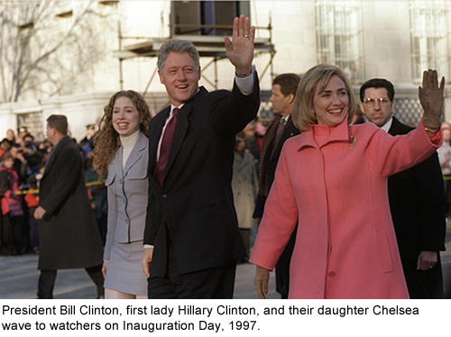 President Bill Clinton, first lady Hillary Clinton, and their daughter Chelsea wave to watchers on Inauguration Day, January 20, 1997.