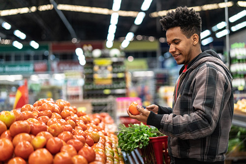 man buying tomatoes