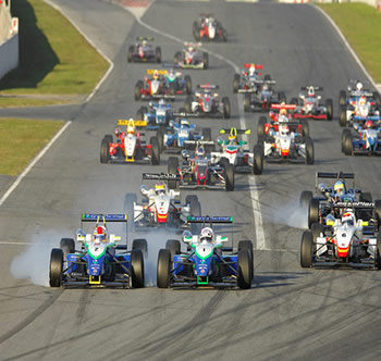 car race with tire smoke coming from the tires