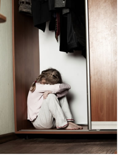 "Image of a child in a closet"