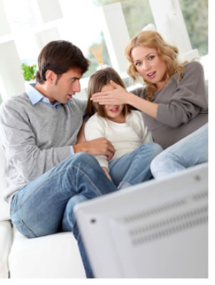 "Image of parents covering their child's eyes while watching TV."