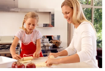 "Image of a mother and daughter cooking together"