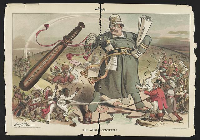 Teddy Roosevelt dressed as a constable, wielding a large club and dividing two arguing groups, which represent countries