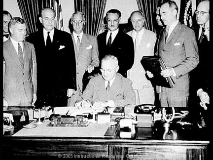 Truman signing the NATO treaty